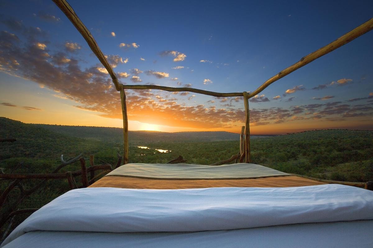 Wake up with the East African sunrise at the Loisaba Star Beds in Kenya
