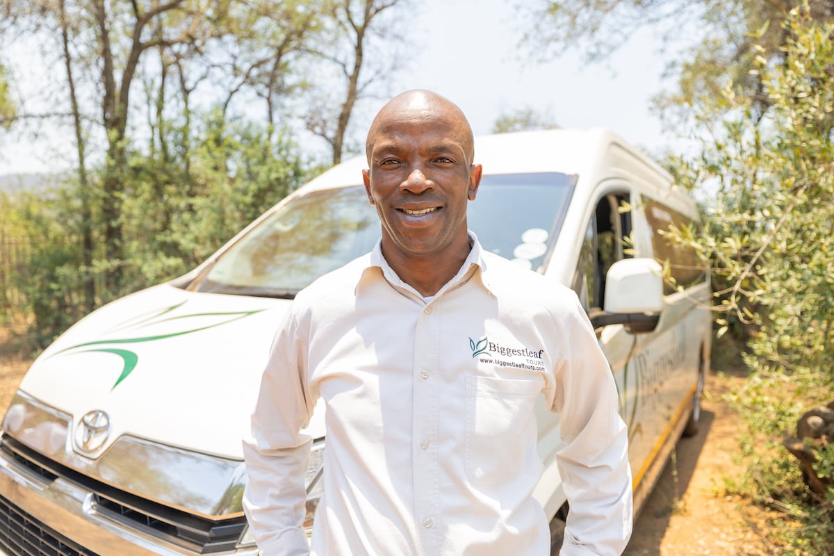 A Biggestleaf transfer driver with his vehicle
